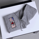 Sweat à capuche gris plié - modèle brodé